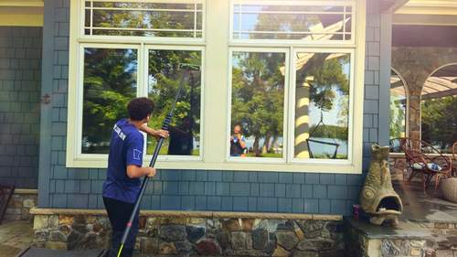 Window cleaning on a lakefront home